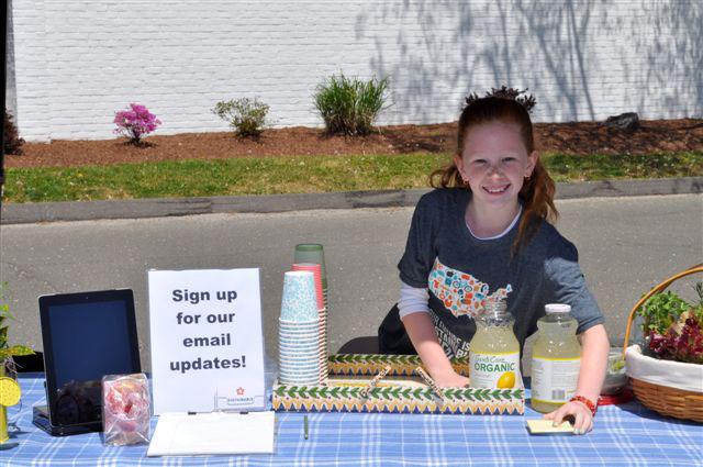 Our lovely booth/lemonade stand helper recruited her peers to make posters.
